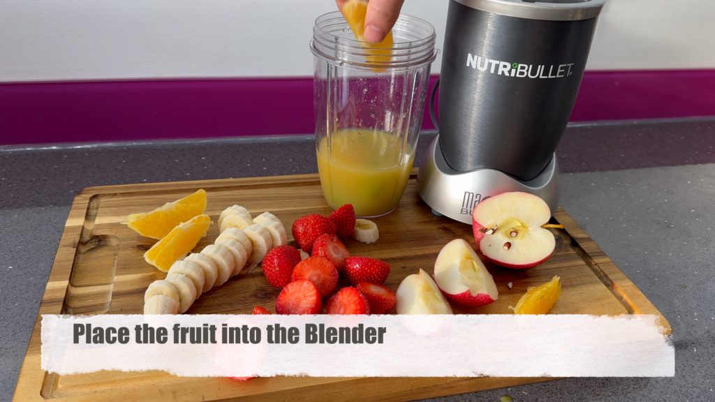 Put the fruit into the blender